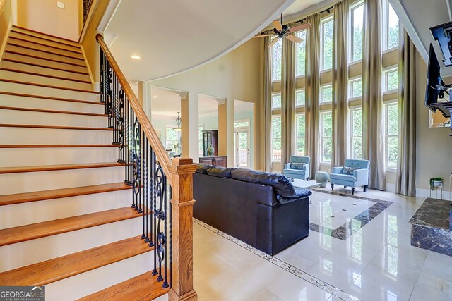 805 Cog Hl, Mcdonough, GA 30253 - living area with plenty of natural light, a high ceiling, stairway, a ceiling fan, and recessed lighting