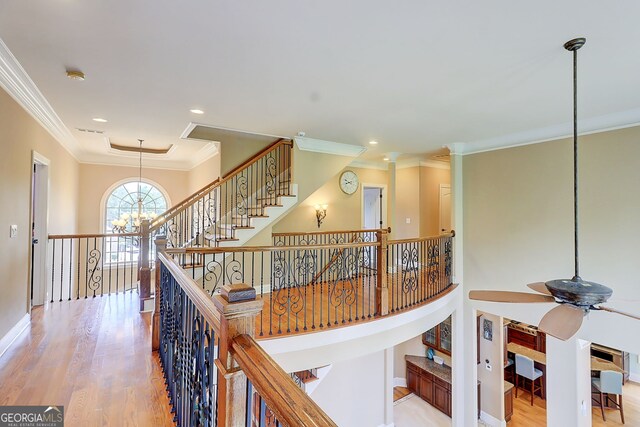 805 Cog Hl, Mcdonough, GA 30253 - hall featuring ornamental molding, a chandelier, wood finished floors, an upstairs landing, and recessed lighting