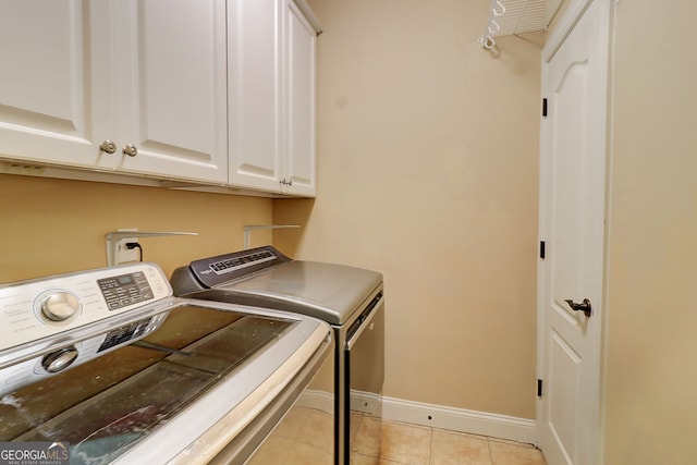 805 Cog Hl, Mcdonough, GA 30253 - laundry room featuring washer and dryer, cabinet space, and light tile patterned flooring