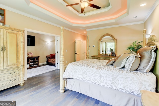 805 Cog Hl, Mcdonough, GA 30253 - bedroom featuring a raised ceiling, dark wood-type flooring, ornamental molding, and ceiling fan