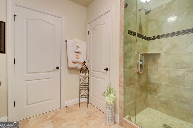 805 Cog Hl, Mcdonough, GA 30253 - bathroom featuring a stall shower and baseboards