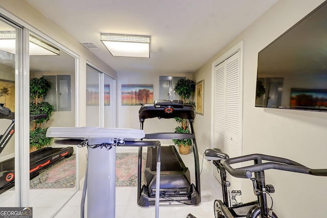 805 Cog Hl, Mcdonough, GA 30253 - exercise room featuring electric panel and tile patterned flooring