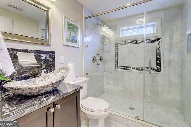 805 Cog Hl, Mcdonough, GA 30253 - bathroom with a stall shower, vanity, and decorative backsplash