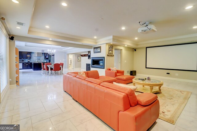 805 Cog Hl, Mcdonough, GA 30253 - home theater room featuring a chandelier, a tray ceiling, recessed lighting, and ornamental molding
