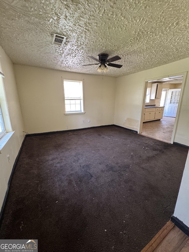 1004 Mapp St, Madison, GA 30650 - carpeted empty room featuring a ceiling fan and baseboards