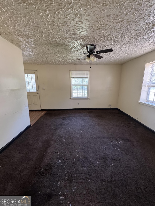 1004 Mapp St, Madison, GA 30650 - carpeted spare room featuring healthy amount of natural light, ceiling fan, and a textured ceiling
