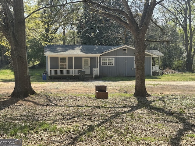 1004 Mapp St, Madison, GA 30650 - view of front of house with a porch and board and batten siding