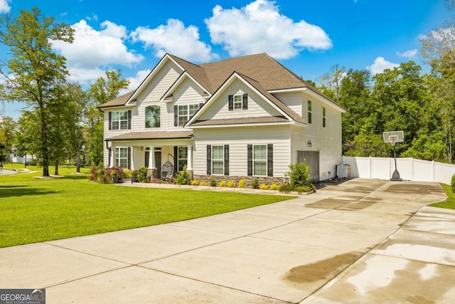 89 Crestview Dr, Guyton, GA 31312 - craftsman-style house featuring covered porch, driveway, stone siding, and a shingled roof
