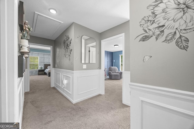 89 Crestview Dr, Guyton, GA 31312 - corridor with attic access, light colored carpet, and a wainscoted wall