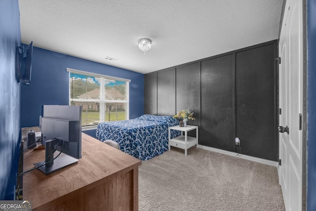 89 Crestview Dr, Guyton, GA 31312 - bedroom featuring carpet flooring, a textured ceiling, a decorative wall, and a desk