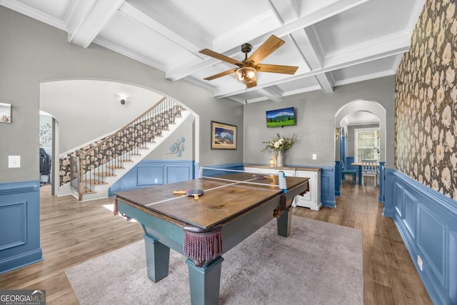 89 Crestview Dr, Guyton, GA 31312 - game room with arched walkways, ceiling fan, beamed ceiling, wood finished floors, and a wainscoted wall