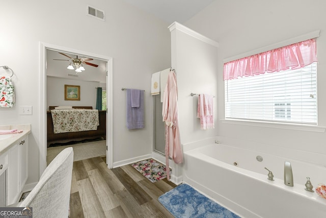 58 Lilyfield Ln, Acworth, GA 30101 - ensuite bathroom with wood finished floors, a tub with jets, a ceiling fan, vanity, and a shower