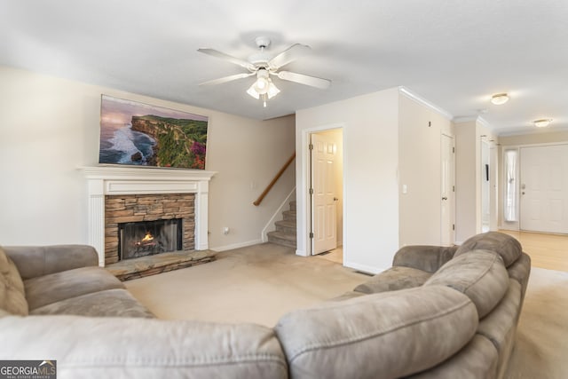 8810 Brookhurst Trl, Gainesville, GA 30506 - carpeted living area featuring stairway, a ceiling fan, and a stone fireplace