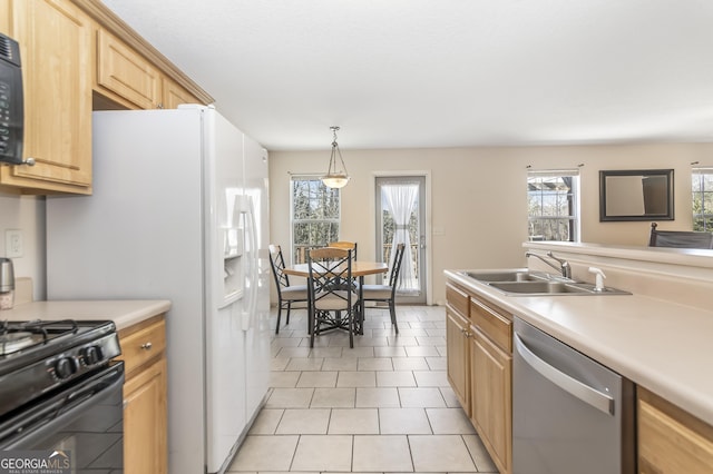8810 Brookhurst Trl, Gainesville, GA 30506 - kitchen featuring stainless steel dishwasher, black range with gas stovetop, light brown cabinets, and light countertops