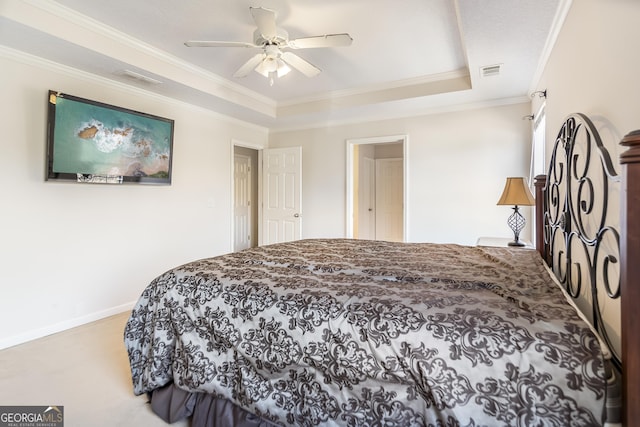 8810 Brookhurst Trl, Gainesville, GA 30506 - carpeted bedroom with ornamental molding, a tray ceiling, and a ceiling fan
