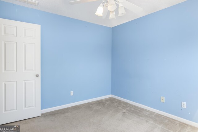 8810 Brookhurst Trl, Gainesville, GA 30506 - carpeted spare room with baseboards and ceiling fan