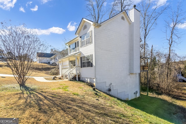 8810 Brookhurst Trl, Gainesville, GA 30506 - view of property exterior with a chimney and a yard