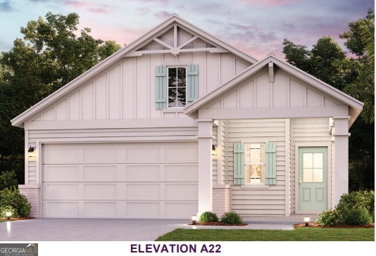 204 Camden Woods Pkwy, Kingsland, GA 31548 - view of front facade featuring board and batten siding, driveway, and a garage