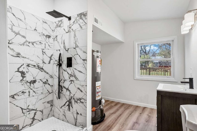 5153 Westbrook Pl, Union City, GA 30291 - full bathroom featuring a tile shower, wood finished floors, water heater, and vanity