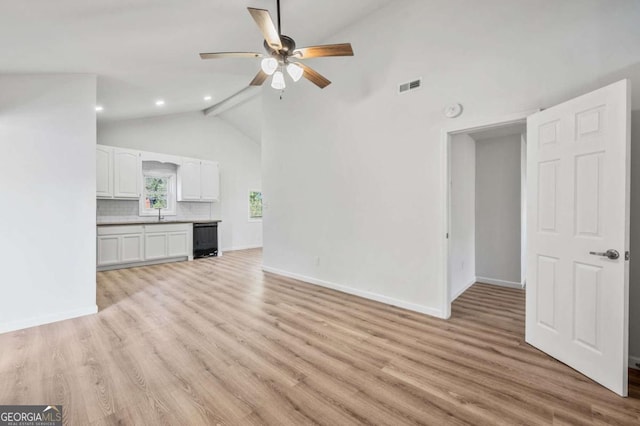 5153 Westbrook Pl, Union City, GA 30291 - unfurnished living room with a ceiling fan, light wood-style flooring, recessed lighting, and high vaulted ceiling