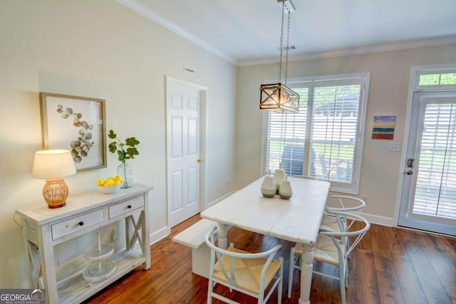 2557 Avery Park Cir, Atlanta, GA 30360 - dining area with dark wood-style floors, crown molding, and a chandelier