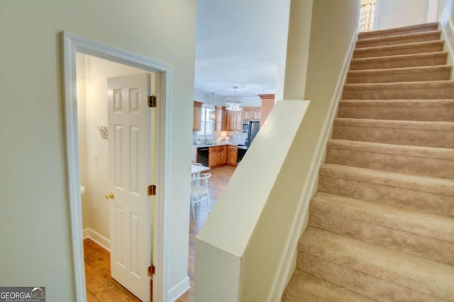 2557 Avery Park Cir, Atlanta, GA 30360 - stairs featuring wood finished floors and baseboards