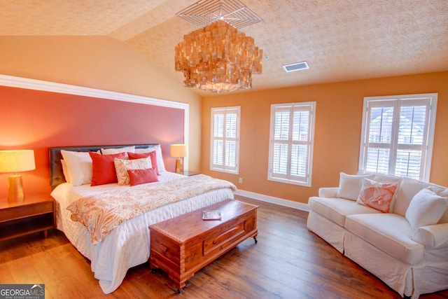 2557 Avery Park Cir, Atlanta, GA 30360 - bedroom featuring vaulted ceiling and wood finished floors