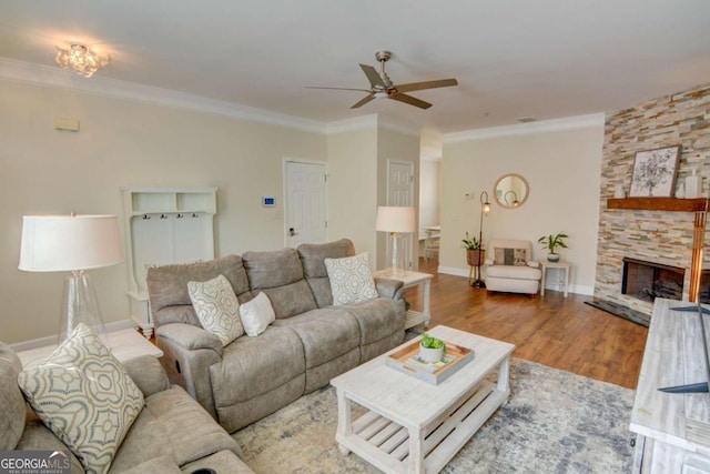 2557 Avery Park Cir, Atlanta, GA 30360 - living room featuring ceiling fan, ornamental molding, a fireplace, and wood finished floors