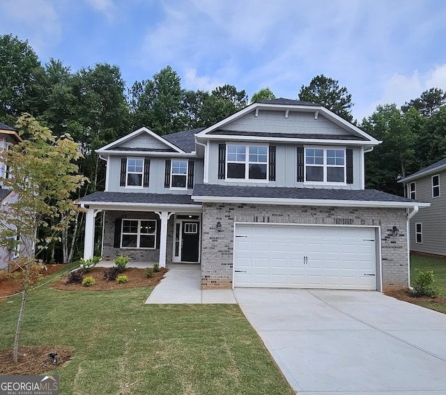 206 Laney Dr # 63, Carrollton, GA 30119 - craftsman-style home with an attached garage, driveway, a front yard, and brick siding
