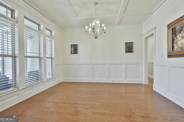118 Fire Creek Trl, Senoia, GA 30276 - unfurnished room featuring coffered ceiling, a chandelier, a decorative wall, light wood-style flooring, and crown molding