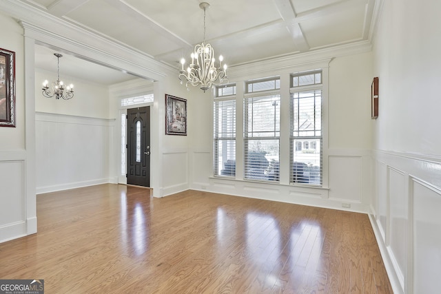 118 Fire Creek Trl, Senoia, GA 30276 - foyer with a chandelier, a decorative wall, coffered ceiling, beamed ceiling, and wood finished floors