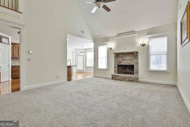 118 Fire Creek Trl, Senoia, GA 30276 - unfurnished living room featuring carpet flooring, a ceiling fan, a fireplace, and high vaulted ceiling