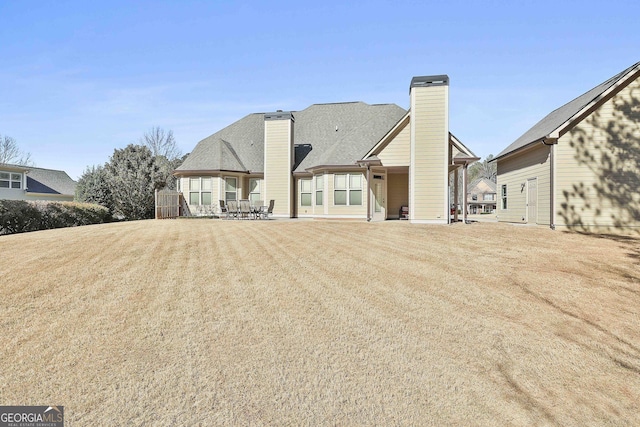118 Fire Creek Trl, Senoia, GA 30276 - back of property featuring a chimney
