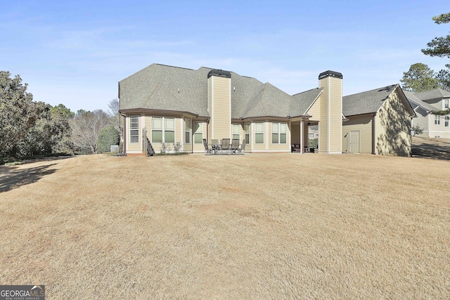 118 Fire Creek Trl, Senoia, GA 30276 - back of property featuring a chimney
