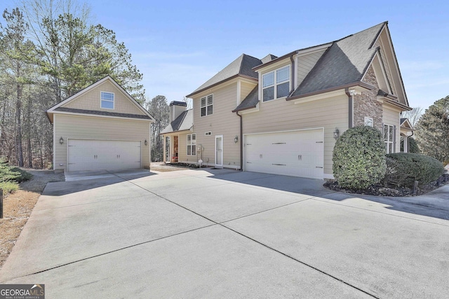 118 Fire Creek Trl, Senoia, GA 30276 - view of front facade with concrete driveway and roof with shingles