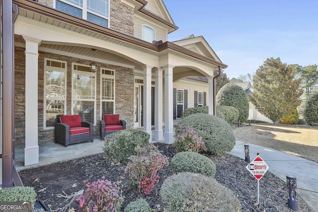 118 Fire Creek Trl, Senoia, GA 30276 - entrance to property featuring covered porch and stone siding