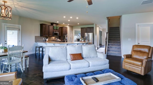8325 Post Oak Ln, Gainesville, GA 30506 - living area with a ceiling fan, stairway, recessed lighting, dark wood-style flooring, and a chandelier