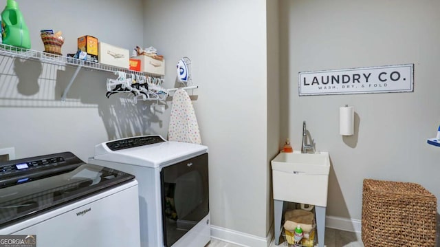 8325 Post Oak Ln, Gainesville, GA 30506 - laundry room with separate washer and dryer and baseboards