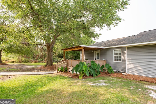 313 White Pine Highway, Nicholls, GA 31554 - view of grassy yard with a deck