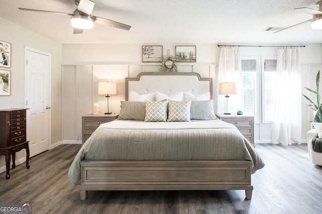 313 White Pine Highway, Nicholls, GA 31554 - bedroom featuring wood finished floors, ceiling fan, and a textured ceiling