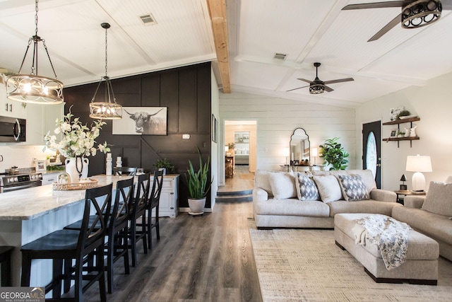 313 White Pine Highway, Nicholls, GA 31554 - living room with a ceiling fan, dark wood-style flooring, wood walls, and a chandelier