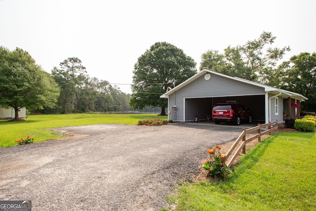 313 White Pine Highway, Nicholls, GA 31554 - view of side of property featuring a yard, a garage, and an outbuilding