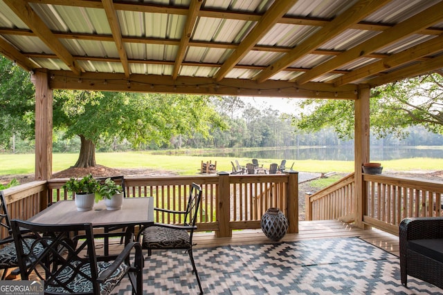 313 White Pine Highway, Nicholls, GA 31554 - wooden terrace with outdoor dining space, a yard, and a water view