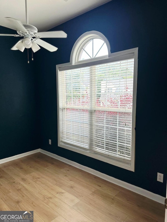 6834 White Walnut Way, Braselton, GA 30517 - spare room featuring a ceiling fan and wood finished floors