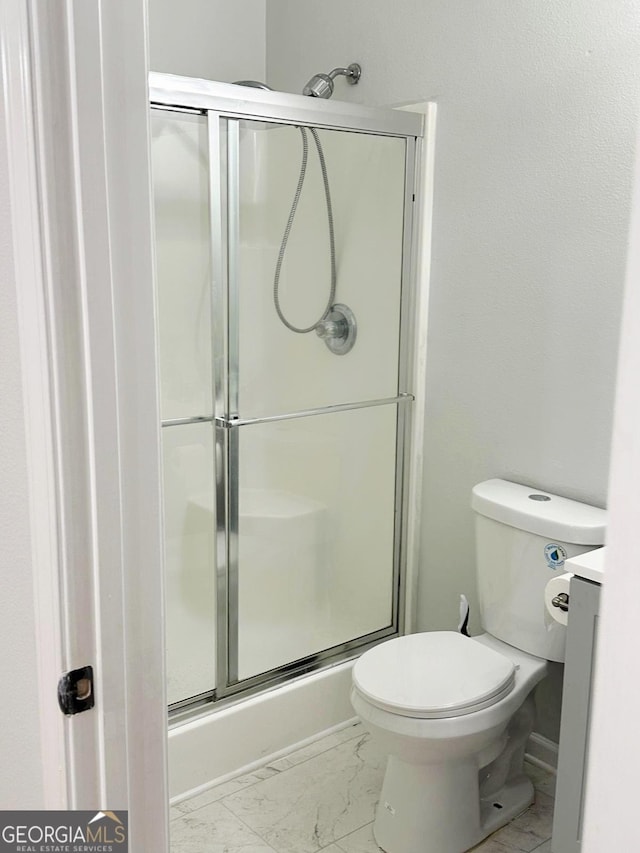 6834 White Walnut Way, Braselton, GA 30517 - full bathroom with a shower with shower door, marble finish floors, and vanity