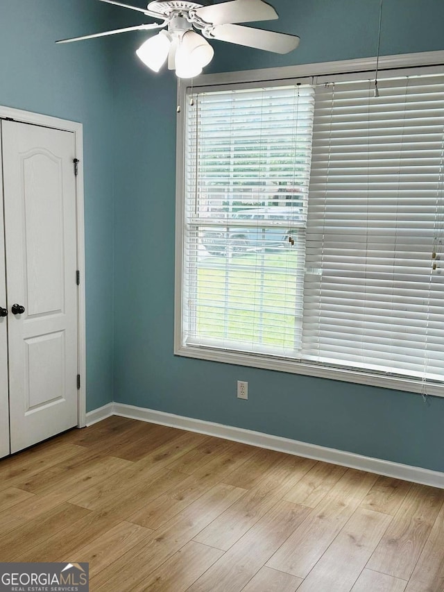 6834 White Walnut Way, Braselton, GA 30517 - spare room with a ceiling fan and light wood finished floors