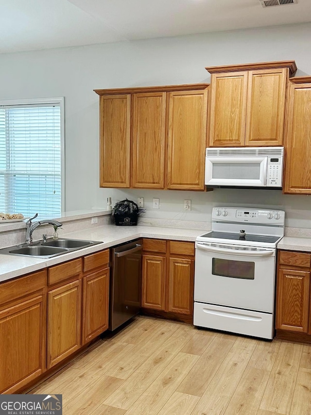 6834 White Walnut Way, Braselton, GA 30517 - kitchen featuring white appliances, light wood-type flooring, light countertops, and brown cabinets
