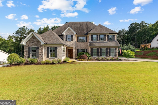 150 Dean Dr, Tyrone, GA 30290 - view of front of property with a front lawn, stone siding, and a shingled roof