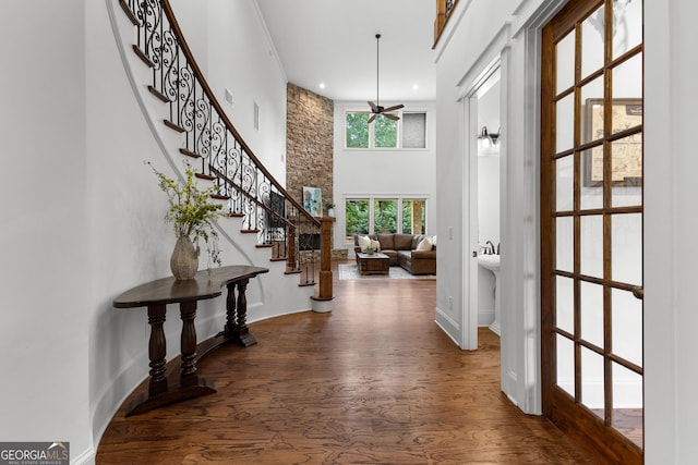 150 Dean Dr, Tyrone, GA 30290 - entryway with a ceiling fan, wood finished floors, a towering ceiling, stairs, and recessed lighting