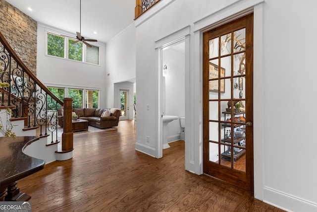150 Dean Dr, Tyrone, GA 30290 - entrance foyer featuring wood finished floors, a ceiling fan, stairway, and a towering ceiling